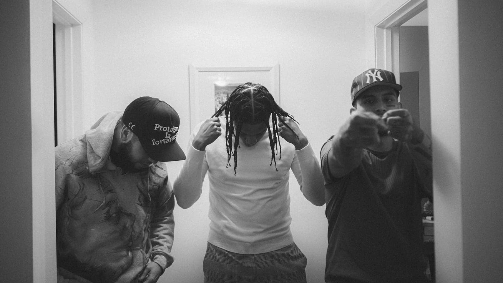 A group of men standing in a hallway next to each other