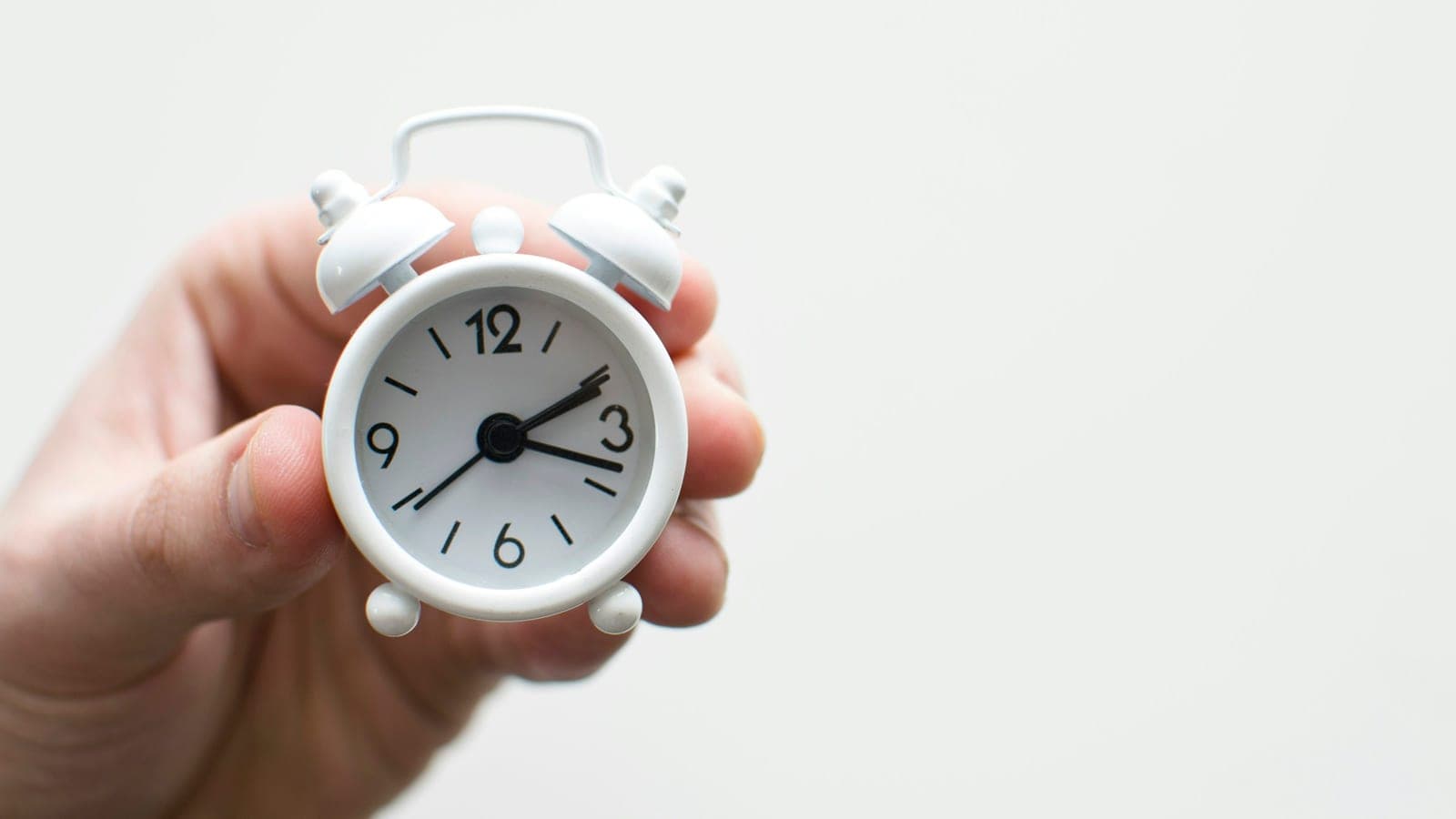 Alarm clock friends situation with hand