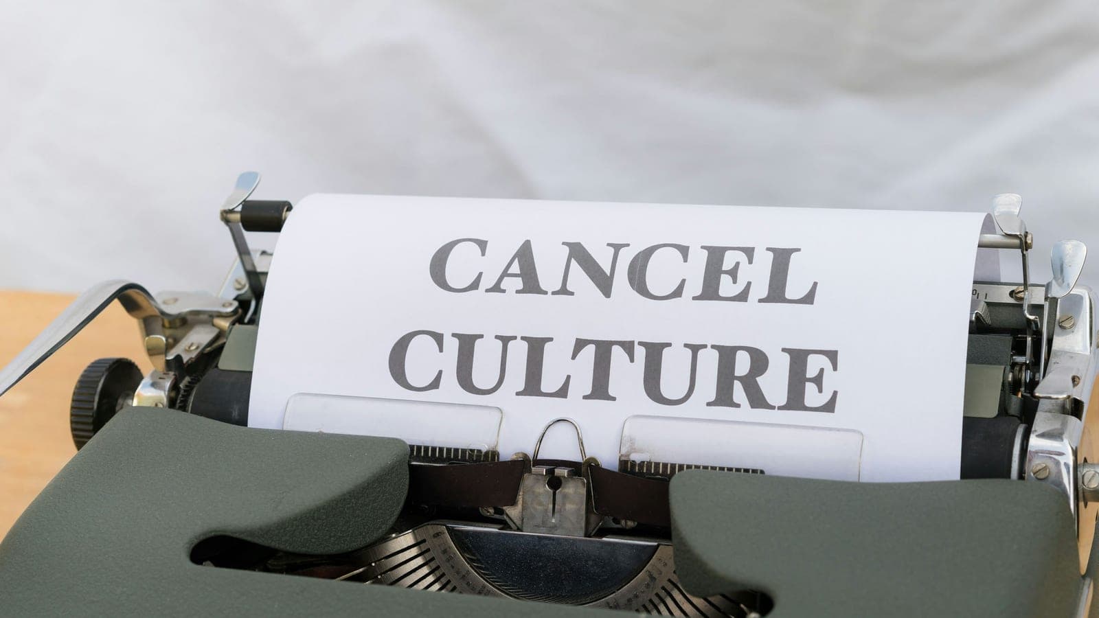 A close up of a typewriter with a paper on it